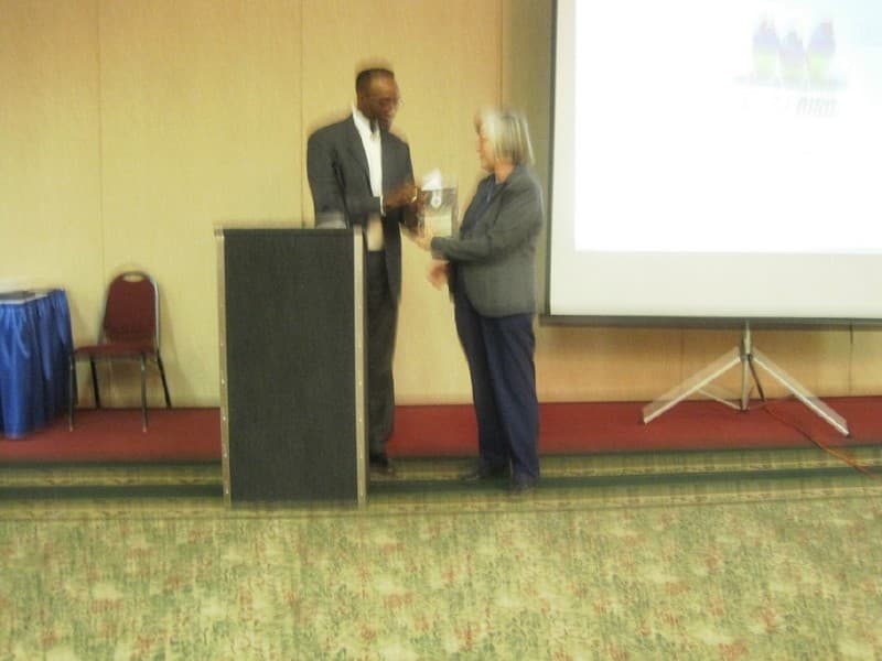Andrew Johnson presents an award